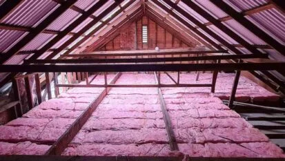 Ceiling insulation batts fitted between timber joists in a roof space