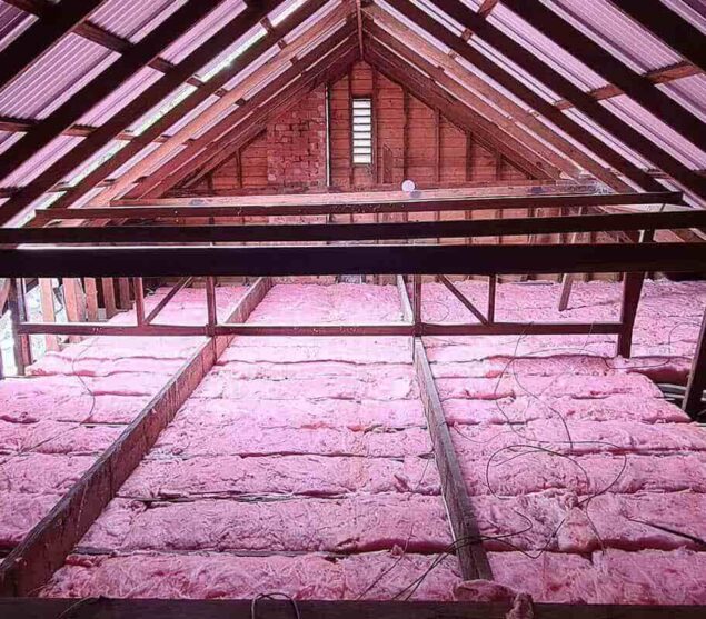 Ceiling insulation batts fitted between timber joists in a roof space